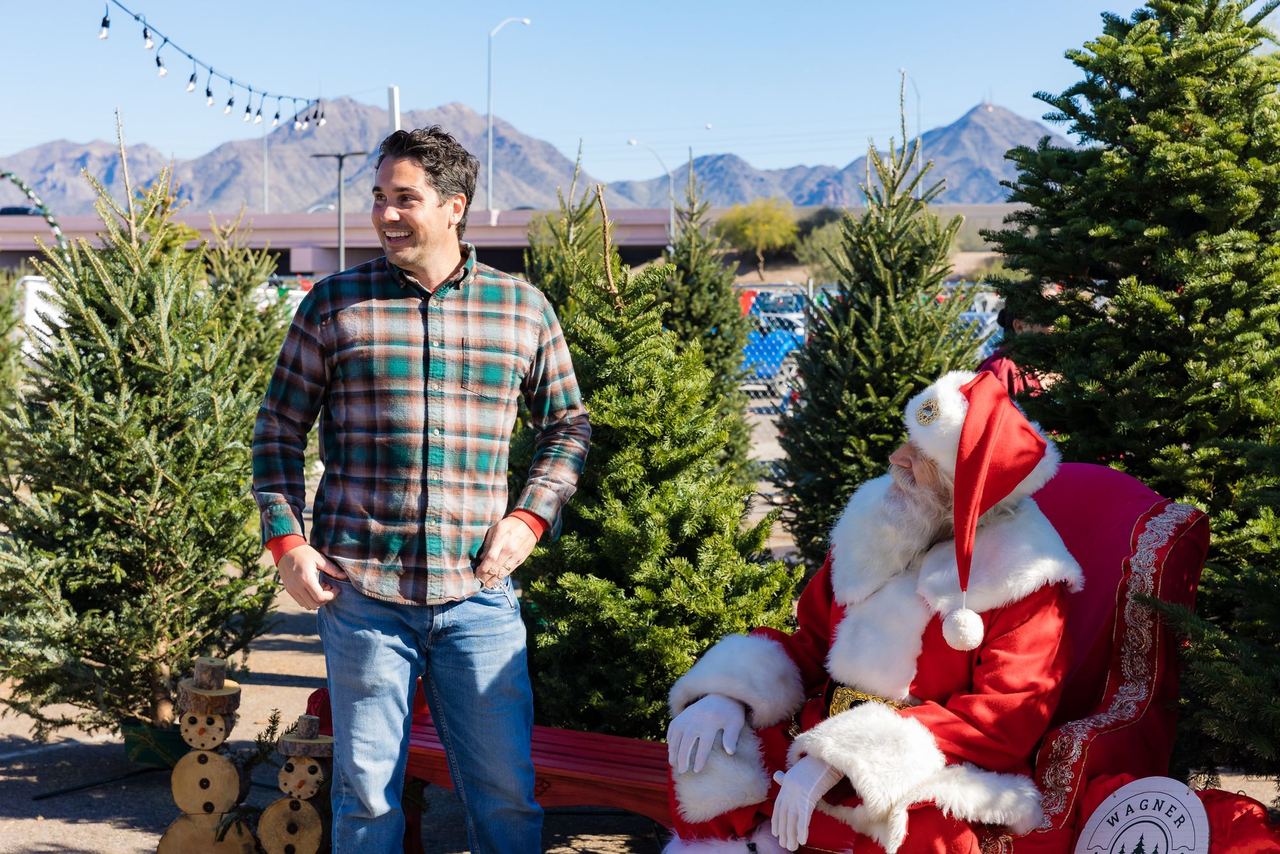 Ryan with Santa at the lot, McDowell Mountains behind